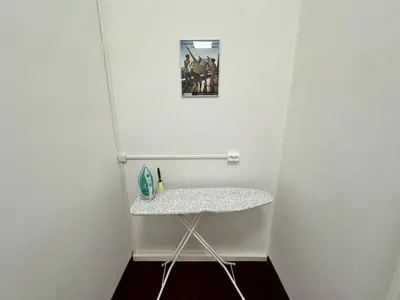 a small table in a room with a picture on the wall at Fantastic-Inn Kraków - GR6 in Kraków