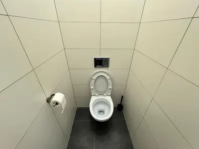 a bathroom with a toilet in a stall at Fantastic-Inn Kraków - GR6 in Kraków