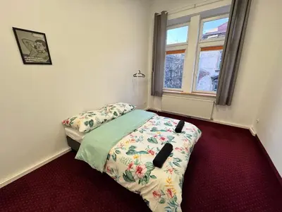 a small bedroom with a bed and a window at Fantastic-Inn Kraków - GR6 in Kraków