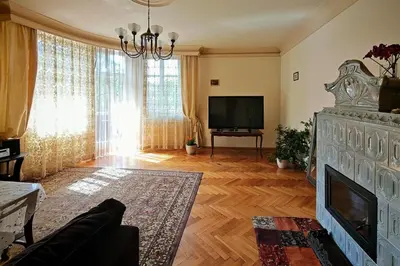 a living room with a fireplace and a television at Crystal in Kraków