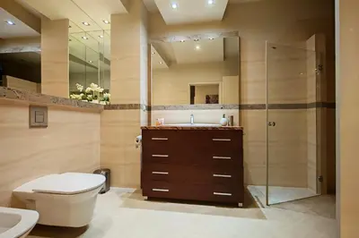 a bathroom with a toilet and a sink and a shower at Crystal in Kraków