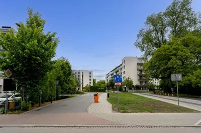 an empty street with a fire hydrant in the middle at Przedwiośnie Chic Harmony Apartment by BookingHost in Kraków