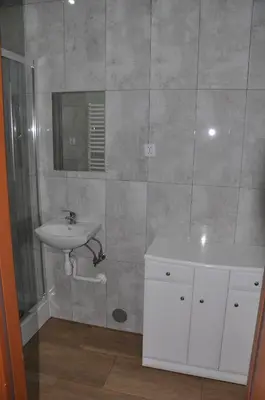 a bathroom with a sink and a mirror at Grodzisko11 in Skała