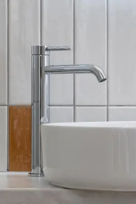 a sink with a faucet in a bathroom at Apartment with balcony - Berka Joselewicza 5 in Kraków
