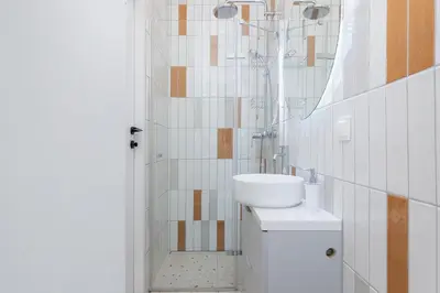 a bathroom with a sink and a mirror at Apartment with balcony - Berka Joselewicza 5 in Kraków