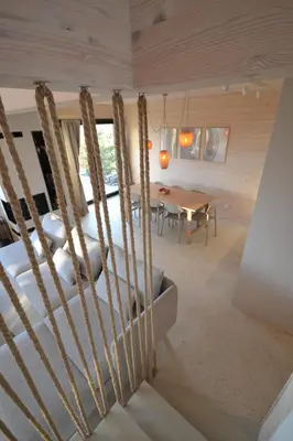 a large bed in a room with large windows at GOLaskowa in Laskowa