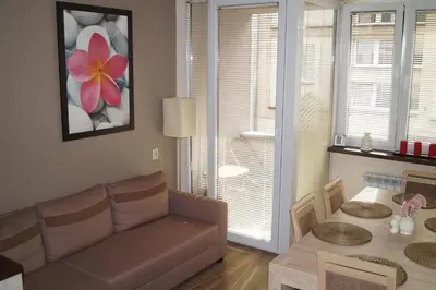 a living room with a couch and a table at Old Town Apartment Kazimierz in Kraków