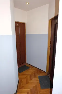 a bedroom with a bed with a book on it at Pokoje Gościnne 