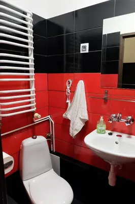 a bedroom with a bed with a painting of the golden gate bridge at Pokoje Gościnne 