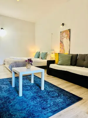 a living room with a couch and a table at BD KRAKOW Apart Hotel in Kraków