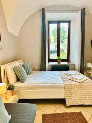 a bedroom with a bed and a window at BD KRAKOW Apart Hotel in Kraków