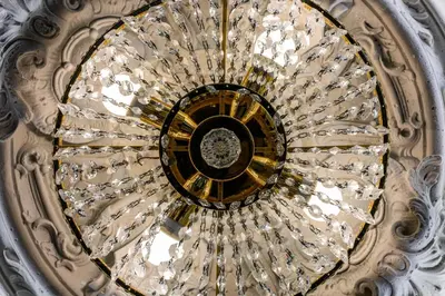 a spiral staircase in a building with crystals at Apartament Marylin in Kraków