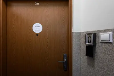 a door in a room with a sign on it at Apartament Marylin in Kraków