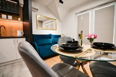 a dining room with a glass table and chairs at Vista Jaśmin 22 by Housine in Zator