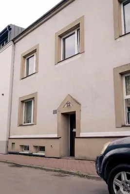 a large building with a door on the side of it at Old Town Gateway in Kraków