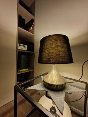 a lamp sitting on top of a glass table at Mieszkanie Centralna Tauron Arena in Kraków