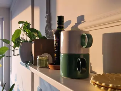 a coffee maker on a counter with a bottle of beer at Mieszkanie Centralna Tauron Arena in Kraków