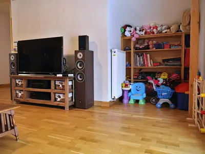 a living room with a flat screen tv and speakers at Babie Zacisze in Zawoja