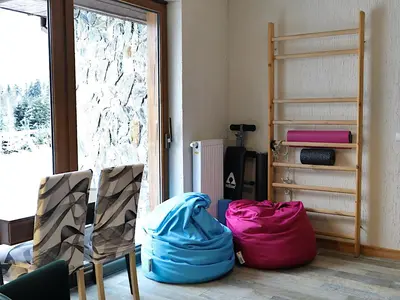a room with two chairs with bags on the floor at Babie Zacisze in Zawoja