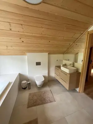 a bathroom with a toilet and a sink at Ostoja Zawoja in Zawoja