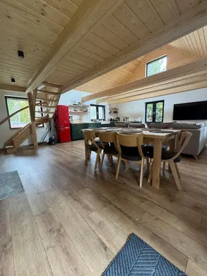 a large living room with a table and chairs at Ostoja Zawoja in Zawoja