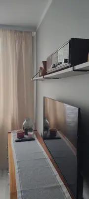 a living room with two tables with bowls on it at Apartament Kraków Łobzów in Kraków