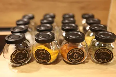 a group of glass jars of honey on a table at Studio Lublańska - przytulne, nowoczesne, w klimacie Krakowa in Kraków