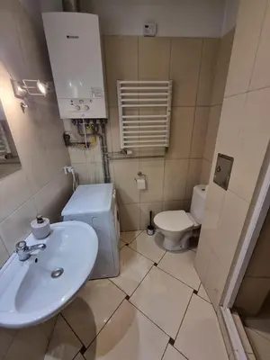 a bathroom with a sink and a toilet at Fantastic-Inn Kraków - KR6 in Kraków