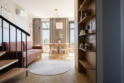 a living room with a couch and a table at Osada Tabaszowa in Tabaszowa