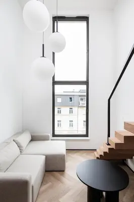 a living room with a couch and a table at City of the Kings-Riverside K22M52 in Kraków