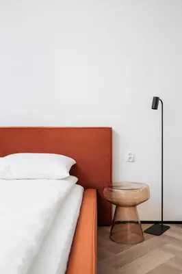 a bedroom with a bed and a table at City of the Kings-Riverside K22M52 in Kraków