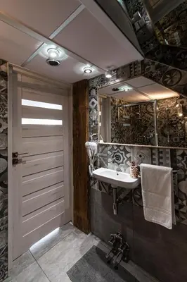 a bathroom with a sink and a mirror at Noble Apartment & Sauna ZONE in Zabierzów