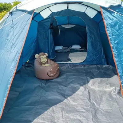 a blue tent with a teddy bear in the inside at Uszate Ranczo in Rybna