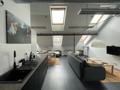 a living room with a couch and a table at Atelier Stare Miasto in Chrzanów
