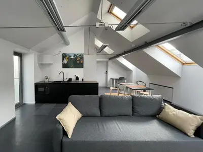 a living room with a couch and a table at Atelier Stare Miasto in Chrzanów