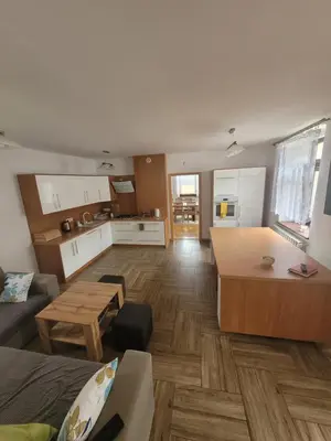 a living room with a couch and a table at Domek obok pustyni