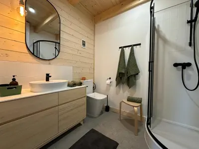 a bathroom with a sink and a shower at BeskiDom in Zawoja