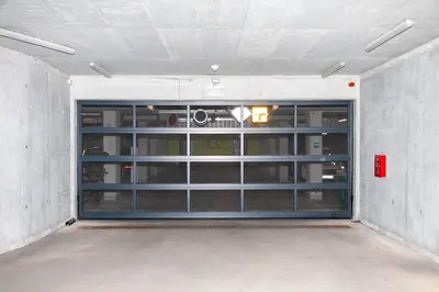 a garage door is open in a room at Apartament Bonarka in Kraków