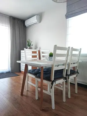 a living room with a couch and a table and chairs at Chill House in Zator