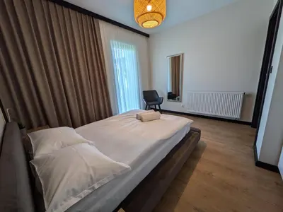 a living room with a couch and a table at Chill House in Zator