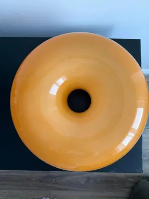 a yellow vase sitting on top of a table at VINCI apartment in Kraków
