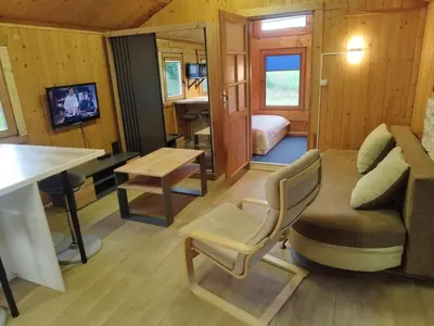 a small living room with a couch and a table at Lavender Retreat in Kraków