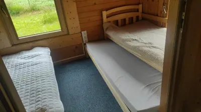 two bunk beds in a room with a window at Lavender Retreat in Kraków