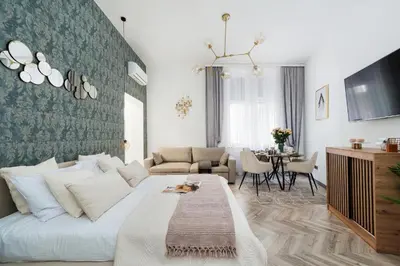 a living room with a white couch and a table at Golden Apartment by Cracovia Prime in Kraków