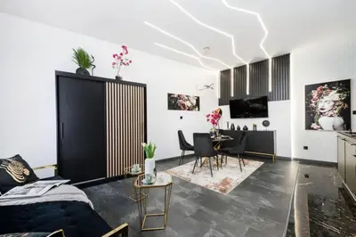 a living room with a couch and a table at Copper Apartment by Cracovia Prime in Kraków