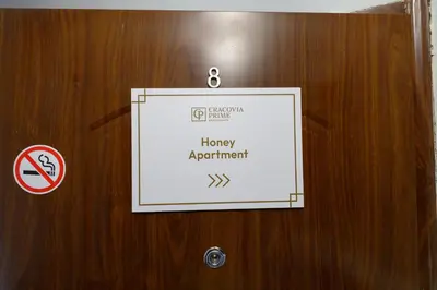 a sign on a door that says happy appointment at Honey Apartment by Cracovia Prime in Kraków