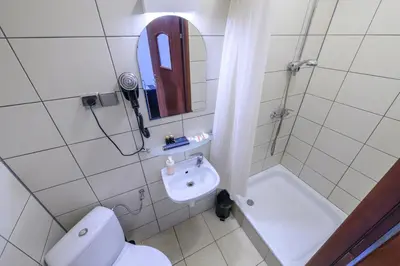 a bathroom with a toilet and a sink and a shower at Loc8 Apartments by Cracovia Prime in Kraków