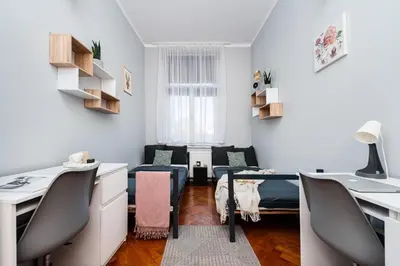 a small office with a desk and chairs in a room at Room8 Apartments by Cracovia Prime in Kraków