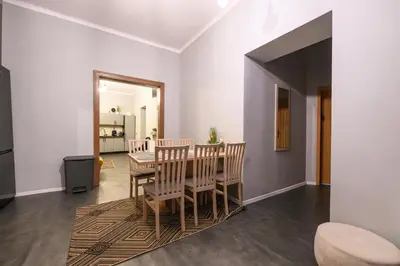 a dining room with a table and chairs at Room8 Apartments by Cracovia Prime in Kraków