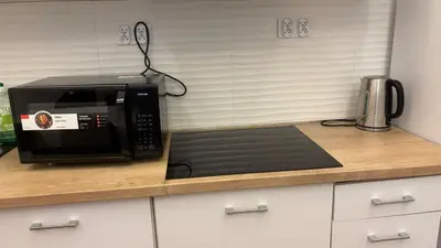 a microwave sitting on a counter in a kitchen at Stradom House Apartment in Kraków
